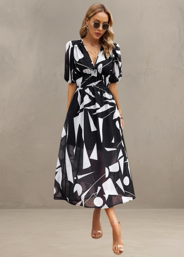 ASTELLA | ROBE MIDI FLORALE FLATTEUSE